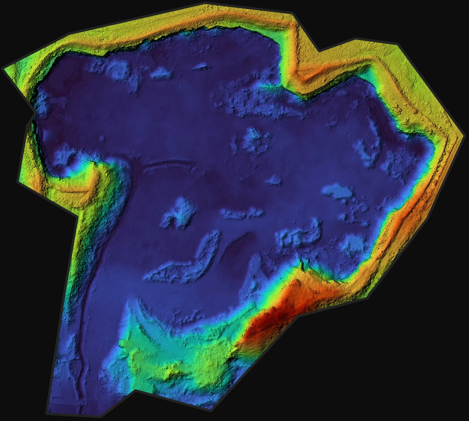 Terrain model of the same quarry, coloured by height: a deep blue floor with higher yellow and red rims.